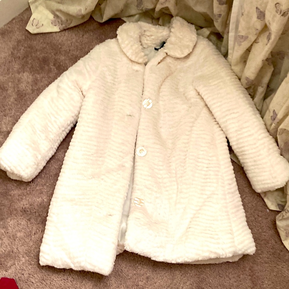 A white fluffy winter jacket